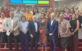 Guests with some of the graduates at the celebration in Mangere.