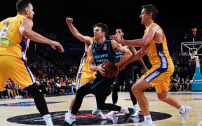 Breakers Tom Abercrombie surrounded by Sydney players.