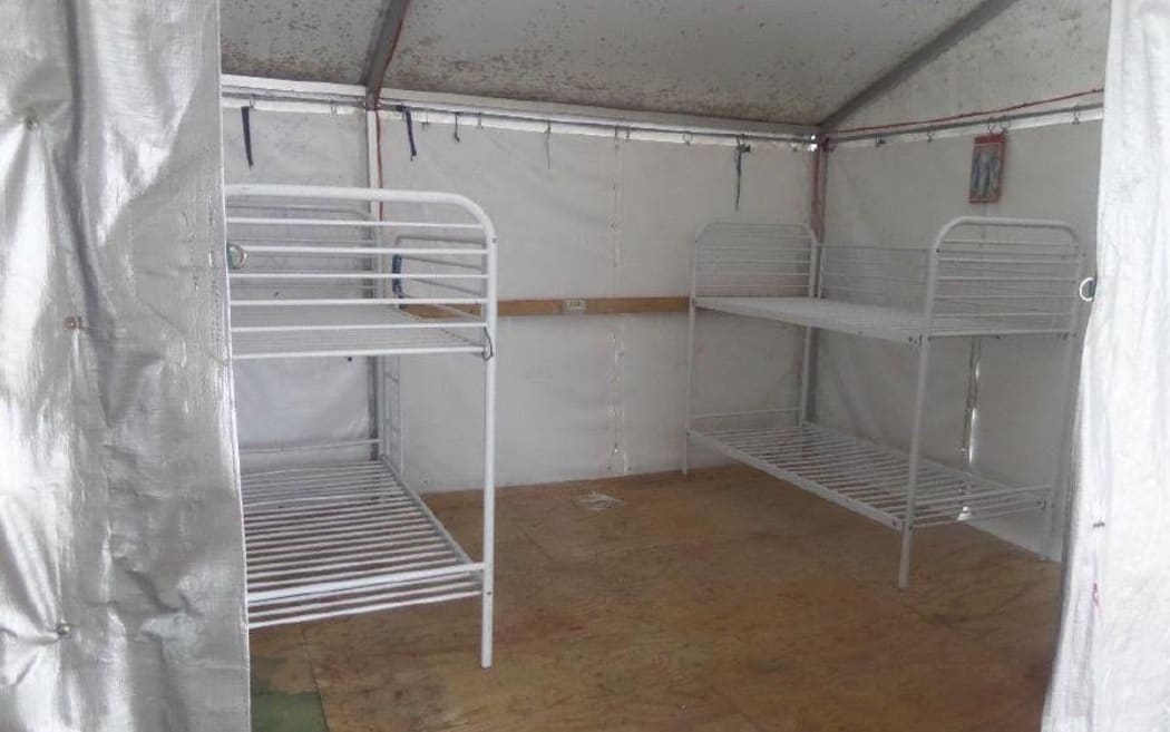 Mouldy tents which have housed refugees on Nauru for years are being pulled down.