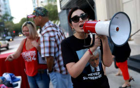 TAMPA, FLORIDA - OCTOBER 05: Laura Loomer shows her support for former President Donald Trump outside a campaign event for Republican presidential candidate Florida Gov. Ron DeSantis at The Vault on October 05, 2023 in Tampa, Florida. Ron DeSantis held the campaign event with Florida sheriffs after receiving endorsements from 60 bipartisan Florida law enforcement officers.   Joe Raedle/Getty Images/AFP (Photo by JOE RAEDLE / GETTY IMAGES NORTH AMERICA / Getty Images via AFP)