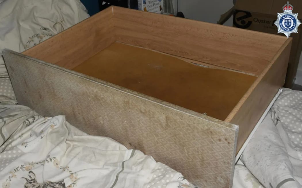 A child was discovered weeks before her third birthday in a drawer under a woman's bed.