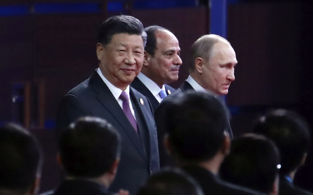 From left, Chinese President Xi Jinping, Egypt's President Abdel-Fattah El-Sisi and Russian President Vladimir Putin arrive for the opening ceremony of the second Belt and Road Forum for International Cooperation (BRF) in Beijing,