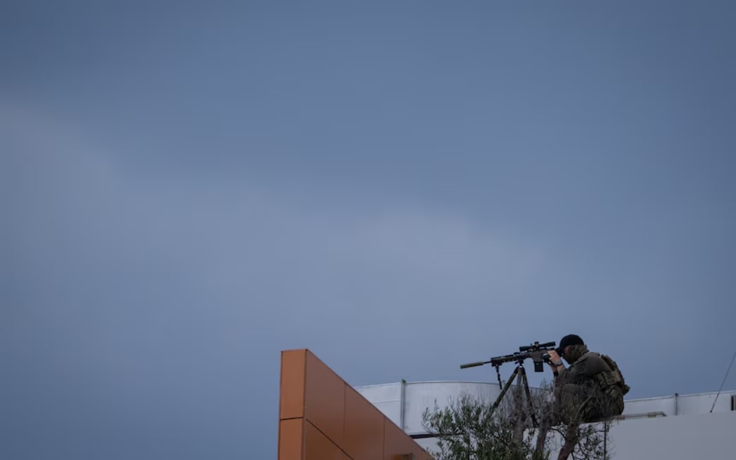 Snipers were stationed around the Day of Reflection event last Sunday. (ABC News: Che Chorley)