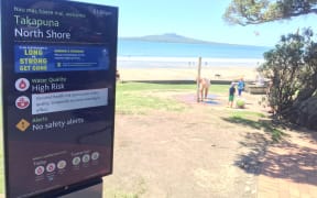 A warning sign at Takapuna beach.