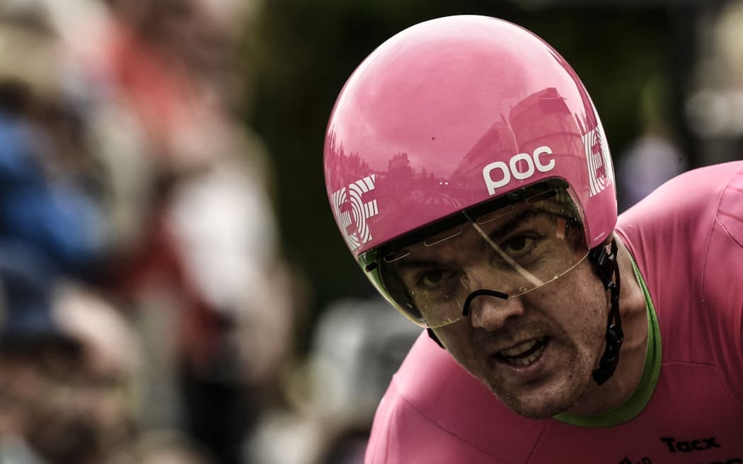 New Zealand's Tom Scully crosses the finish line of the 20th stage of the 105th edition of the Tour de France cycling race, a 31-kilometer individual time-trial between Saint-Pee-sur-Nivelle and Espelette, southwestern France, on July 28, 2018.