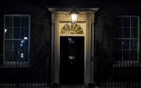 The closed front door to 10 Downing Street is pictured in central London, on October 20, 2022, hours after UK's Prime Minister Liz Truss resigned as leader of the Conservative Party. - British Prime Minister Liz Truss announced her resignation on after just six weeks in office that looked like a descent into hell, triggering a new internal election within the Conservative Party. (Photo by Niklas HALLE'N / AFP)