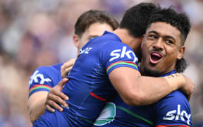 Ali Leiataua celebrates a try with Taine Tuaupiki against Melbourne Storm.