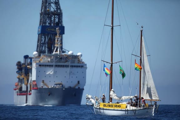 Anadarko's drill ship and a Greenpeace protest boat at the site in November.