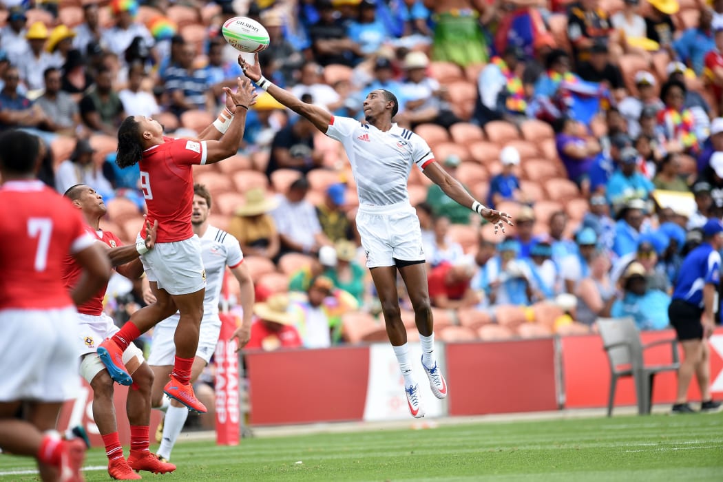 USA speedster Perry Baker broke his jaw following a collision with Tonga captain Tana Fotofili in Hamilton.