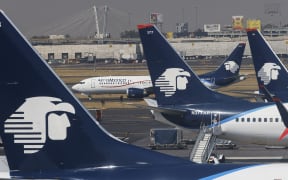 Jets of Mexican flag carrier airline Aeromexico are parked at Mexico City's Benito Juarez International Airport on January 30, 2023. (Photo by David GANNON / AFP)