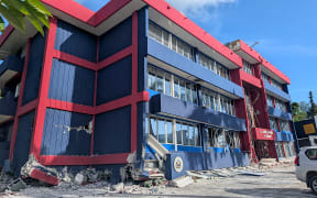 This photo shows a general view of a severely damaged building housing the embassies of the United States, United Kingdom, and New Zealand after a powerful earthquake struck Port Vila, the capital city of Vanuatu, on December 17, 2024.