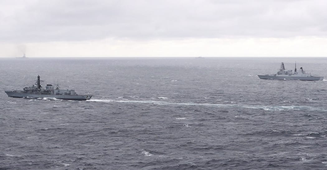British Navy frigate HMS Richmond (L)  and destroyer HMS Duncan (R) escort the Russian Task Group, including aircraft carrier Admiral Kuznetsov (background L) as it transits to the Mediterranean Sea.