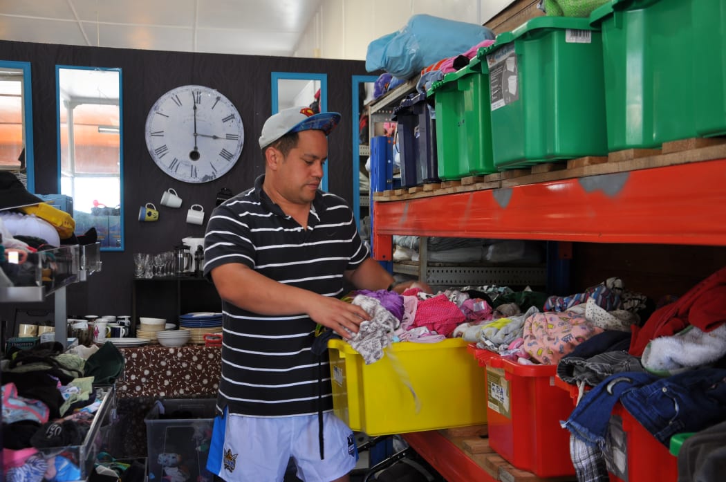 Mikaere Clarkson-Steele of social enterprise NUKU sorts donations at Shop Zero, to support those affected by the flooding.