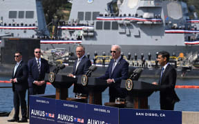 US President Joe Biden (C) speaks alongside British Prime Minister Rishi Sunak (R) and Australian Prime Minister Anthony Albanese (L) at a press conference during the AUKUS summit on March 13, 2023, at Naval Base Point Loma in San Diego California. AUKUS is a trilateral security pact announced on September 15, 2021, for the Indo-Pacific region. (Photo by Jim WATSON / AFP)