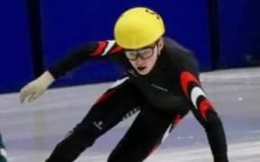 Luke Street competing in short-track speed skating.