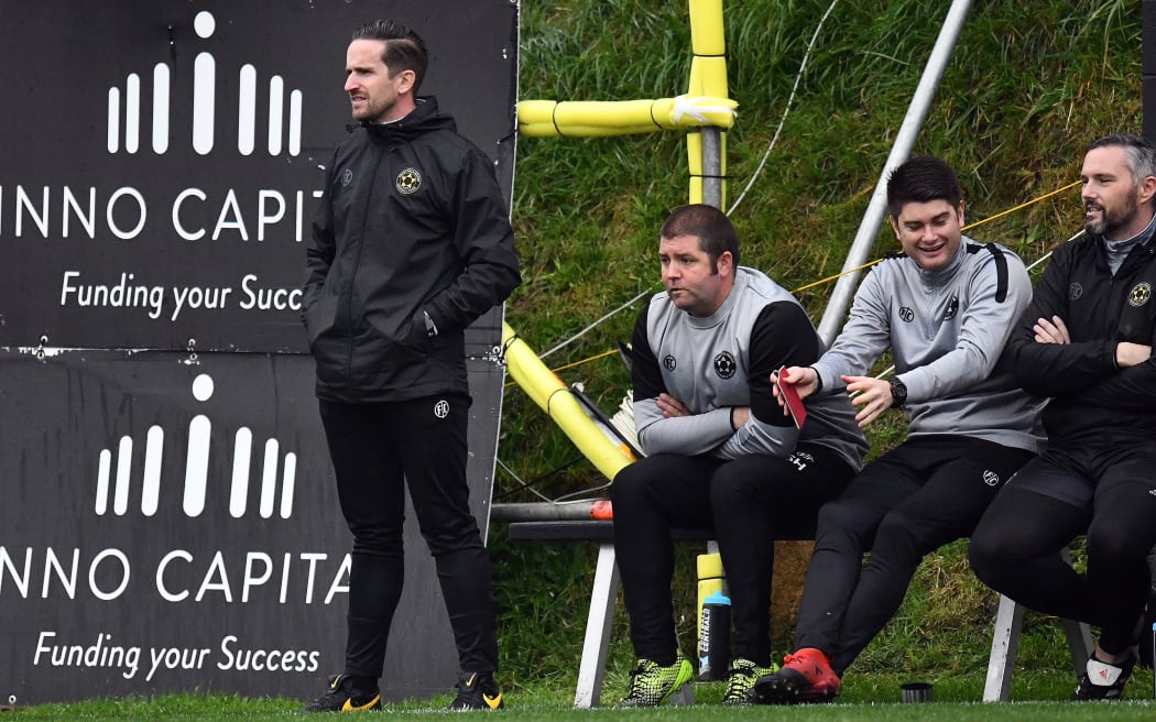 Team Wellington's coach José Figueira (L) looks on.