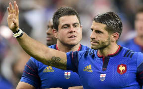 France's Guilhem Guirado and Sebastien Tillous Borde wave to the crowd.