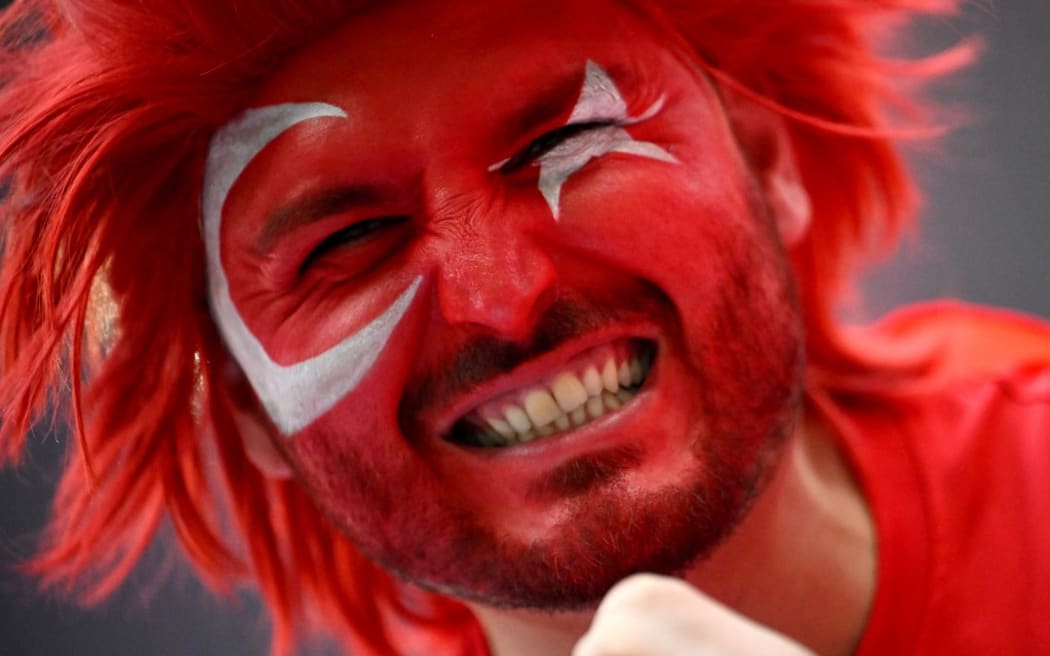 02 July 2024, Saxony, Leipzig: Soccer, UEFA Euro 2024, European Championship, Austria - Turkey, Final round, Round of 16, Leipzig Stadium, A Turkish fan with face paint in the stadium. Photo: Sebastian Christoph Gollnow/dpa (Photo by Sebastian Christoph Gollnow / DPA / dpa Picture-Alliance via AFP)