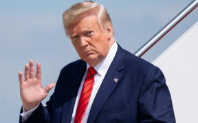 US President Donald Trump disembarks after arriving on Air Force One at Joint Base Andrews in Maryland, September 26, 2019, after returning from New York.