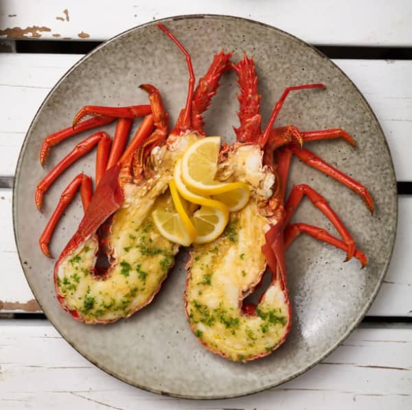 A Nins Bin crayfish with garlic butter and lemon.