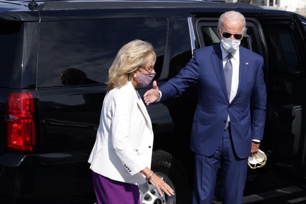NEW CASTLE, DELAWARE - SEPTEMBER 03: Democratic U.S. presidential nominee Joe Biden arrives at New Castle County Airport with his wife Dr. Jill Biden