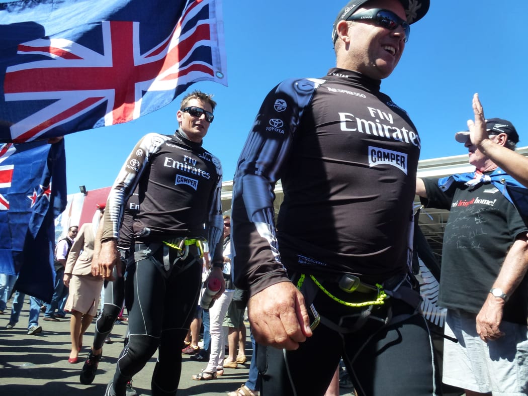 Team New Zealand walks into the Cup Final dockout show in San Francisco in 2013