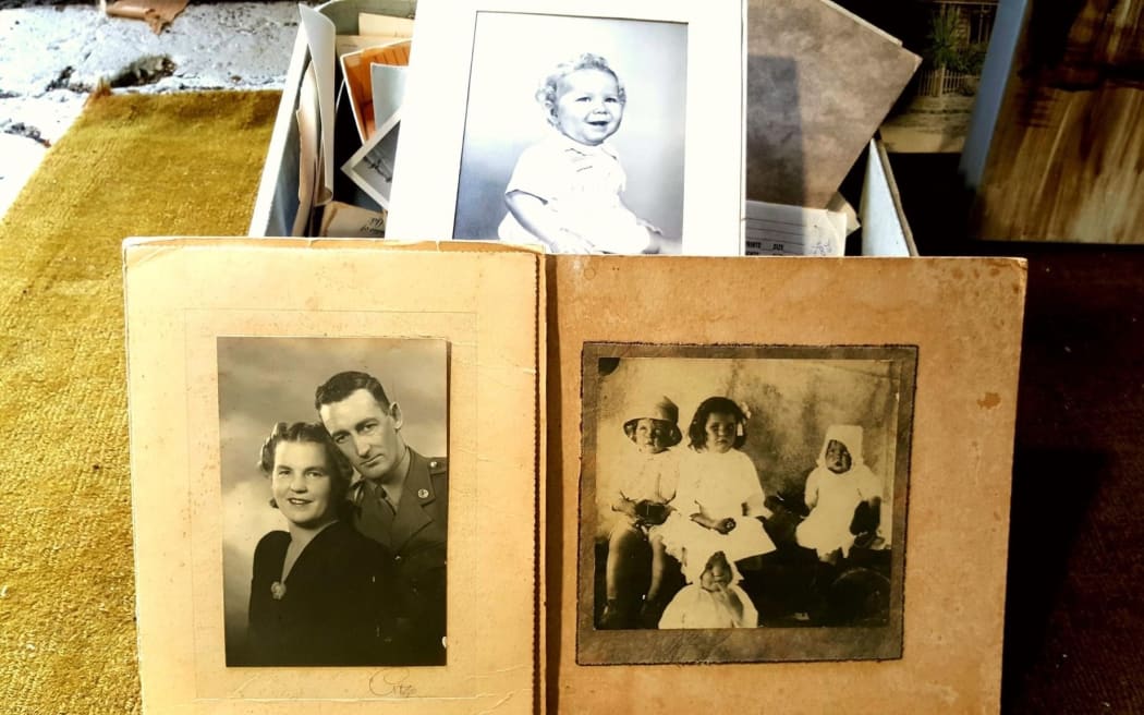 A trove of family photos was discovered in a sewing machine box dropped off at an Auckland community recycling centre.