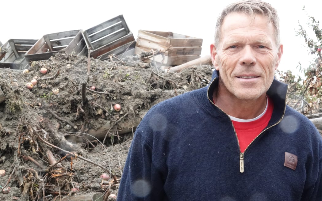 Jerf van Beek standing in front of what used to be an apple orchard on his land.