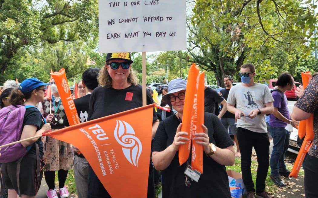 More than 100 University of Auckland staff and supporters rally for workers' rights on Princes Street on 1 March, 2023.