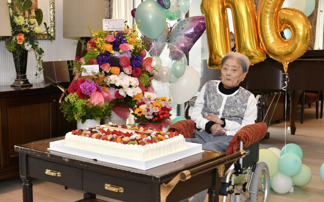 This handout file photo taken on 23 May, 2024 by the Ashiya City government shows Japanese woman Tomiko Itooka as she celebrates her 116th birthday, in the city of Ashiya, Hyogo prefecture. - The world's oldest person, Tomiko Itooka of Japan, has died at the age of 116, the city were she lived announced on January 4, 2025. Itooka, who had four children and five grandchildren, died on December 29 at a nursing home, the city of Ashiya said.