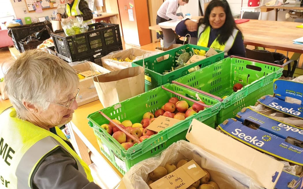 Volunteers are packaging foods at the Perfectly Imperfect pop up stores