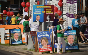Banners and placards outside a polling station in the suburban seat of Bennelong in Sydney