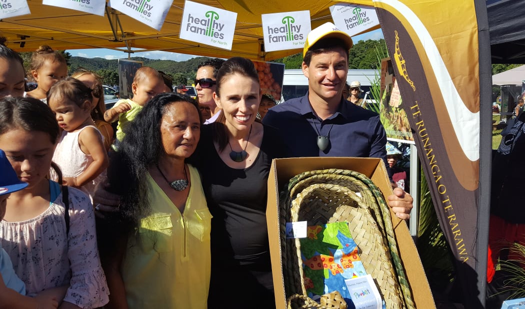 A group of women at Waitangi, who weave wahakura, gifted the prime minister three  flax bassinets.