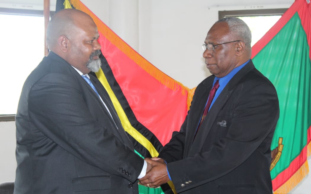 Vanuatu's first high commissioner to New Zealand, Johnson Marakipule, left, is commissioned by President Tallis Obed Moses.