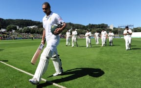 Alviro Petersen leads players off the Basin Reserve, 2012.