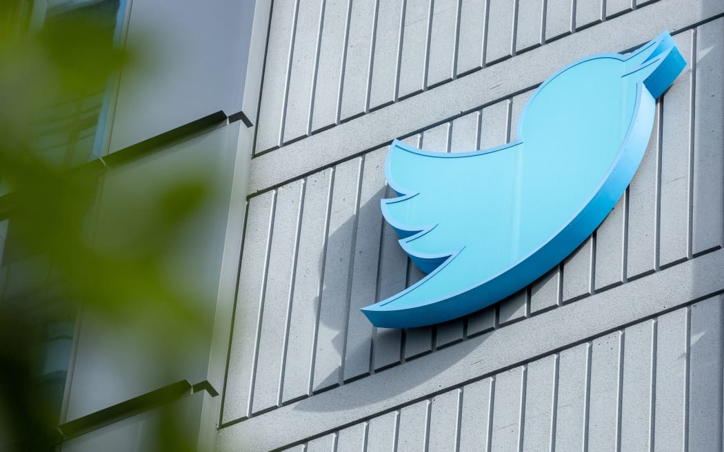 (FILES) In this file photo taken on October 28, 2022, the Twitter logo outside their headquarters in San Francisco, California. - Is it a pipe dream or a possibility? Elon Musk wants to meaningfully diversify Twitter’s revenue stream beyond advertising, but no major social network has managed so far to go without ads altogether. Something of a gold standard, social media ads can be fine-tuned and tailored to individual users on a mass scale, and have been particularly lucrative for Meta's Facebook and Instagram, as well as Google. (Photo by Constanza HEVIA / AFP)