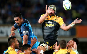 Blade Thomson of the Hurricanes competes at the lineout against Jerome Kaino of the Blues.