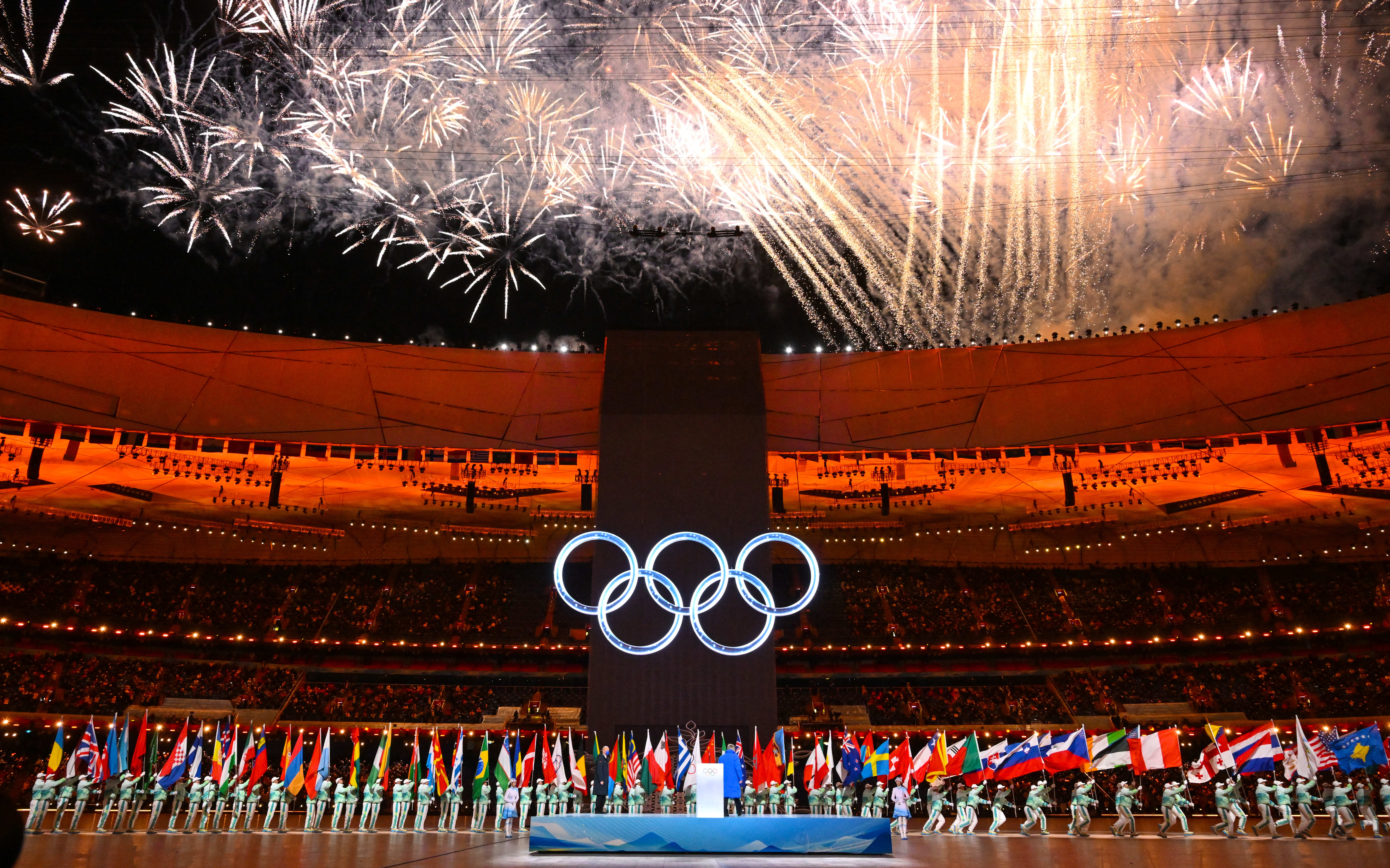 Fireworks explode over the Olympic rings during the opening ceremony of the Beijing 2022 Winter Olympic Games, at the National Stadium, known as the Bird's Nest, in Beijing, on February 4, 2022.