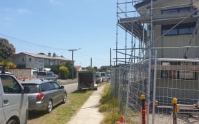 Older state housing across the road from new Kiwibuild homes under construction in Marfell, Taranaki.