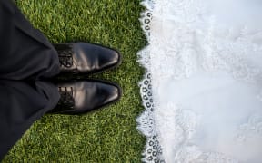 wedding mens shoes and edge of gown