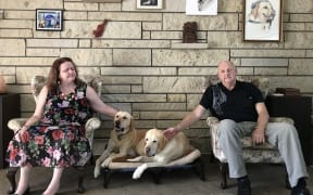 Martine Abel-Williamson and husband Gary with their guide dogs.