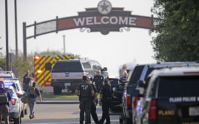 ALLEN, TEXAS - MAY 6: Emergency personnel work the scene of a shooting at Allen Premium Outlets on May 6, 2023 in Allen, Texas. According to reports, a shooter opened fire at the outlet mall, injuring nine people who were taken to local hospitals. The police have confirmed there were fatalities but have not specified how many. The unidentified shooter was neutralized by an Allen Police officer responding to an unrelated call.   Stewart F. House/Getty Images/AFP (Photo by Stewart F. House / GETTY IMAGES NORTH AMERICA / Getty Images via AFP)