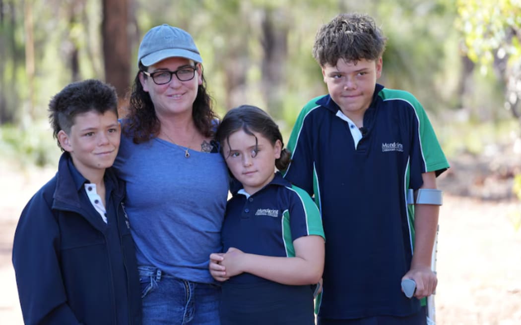 Austin (right) and his brother Beau, mother Joanne and sister Grace (left to right) have recounted their ordeal.
