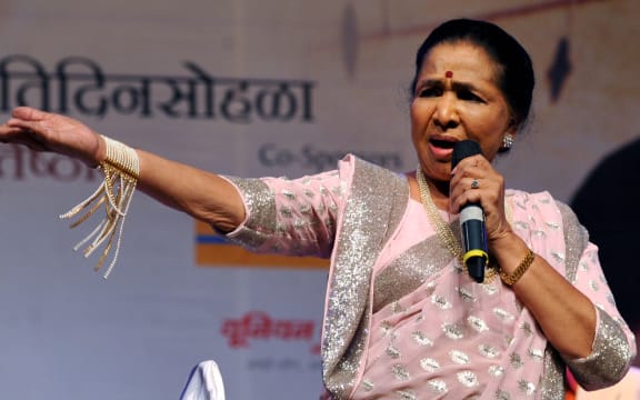 Indian Bollywood playback singer Asha Bhosle performs at The ‘25 Master Deenanath Mangeshkar Awards’ in Mumbai late April 25, 2014.