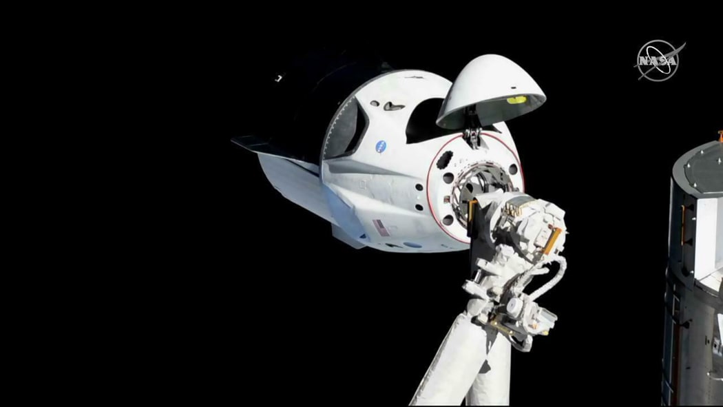 The SpaceX Crew Dragon is pictured about 20 meters (66 feet) away from the International Space Station'ss Harmony module, Sunday, March 3, 2019.