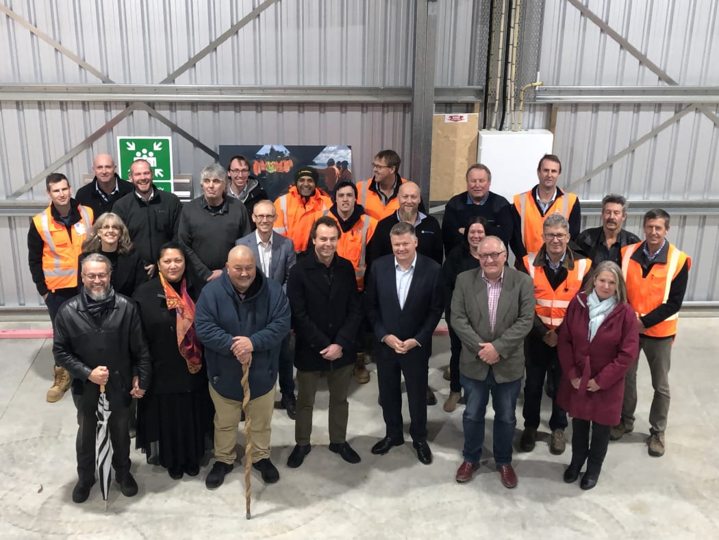 Vic Maggs (Wellington Water), Daren Courtnage, Cos Bruyn (Fulton Hogan), South Wairarapa Mayor Alex Beijen, Carterton Mayor Greg Lang, Rangitāne o Wairarapa cultural advisor Mike Kawana, and Rīhi and Te Rangikaiwhiria Reiri, of Hurunui o Rangi Marae, at the Ruamāhanga Roads [RR] depot in Carterton.