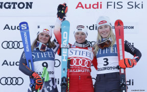 Alice Robinson of Team New Zealand (L) takes 2nd place, Lara Gut-behrami of Team Switzerland takes 1st place, Mikaela Shiffrin of Team United States takes 3rd place at the FIS Alpine Ski World Cup women's Giant Slalom.