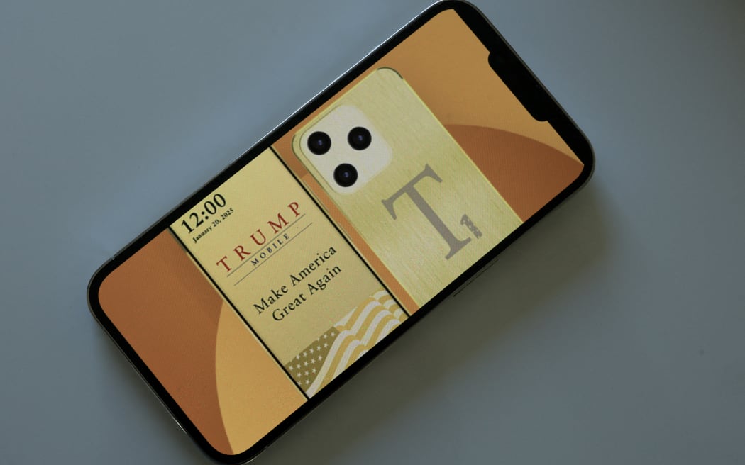 MIAMI, FLORIDA - JUNE 16: In this photo illustration, an iPhone displays the website for The Trump Organization's mobile phone service and a Trump-branded smartphone on June 16, 2025 in Miami, Florida. According to the website, Trump Mobile offers both a cellular plan and a smartphone that will provide the same coverage as the three nationwide phone service carriers. (Photo illustration by Joe Raedle/Getty Images) (Photo by JOE RAEDLE / GETTY IMAGES NORTH AMERICA / Getty Images via AFP)