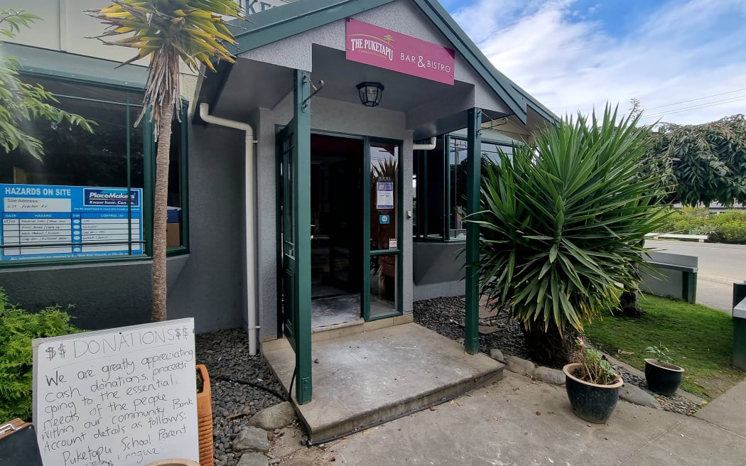 The Puketapu pub with a sign for donations out front.