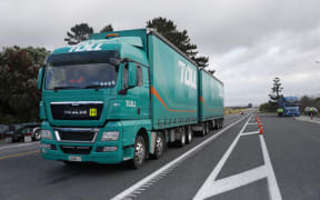 Police teams are stopping trucks that are going south from Whangārei to make sure they're not over the weight limits.